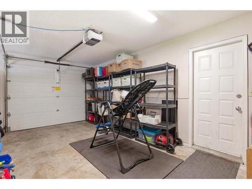 Garage (virtually altered to remove some personal items) - 4337 Dunvegan Court, Kelowna, BC - Indoor Photo Showing Garage