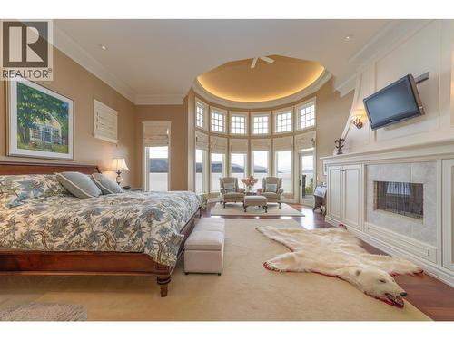 225 Swick Road, Kelowna, BC - Indoor Photo Showing Bedroom With Fireplace