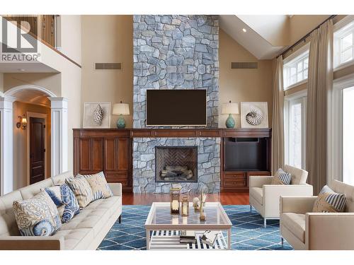 Living rm virtually staged - 225 Swick Road, Kelowna, BC - Indoor Photo Showing Living Room With Fireplace