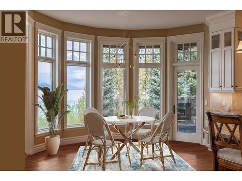 Virtually staged kitchen table - 225 Swick Road, Kelowna, BC - Indoor Photo Showing Dining Room