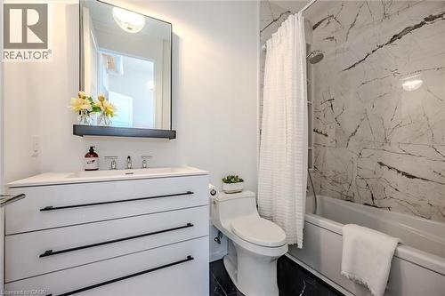 Full bath featuring vanity and shower / bath combo - 19 Guelph Avenue Unit# 308, Cambridge, ON - Indoor Photo Showing Other Room