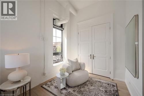 Sitting room with light wood-style floors - 19 Guelph Avenue Unit# 308, Cambridge, ON - Indoor Photo Showing Bedroom