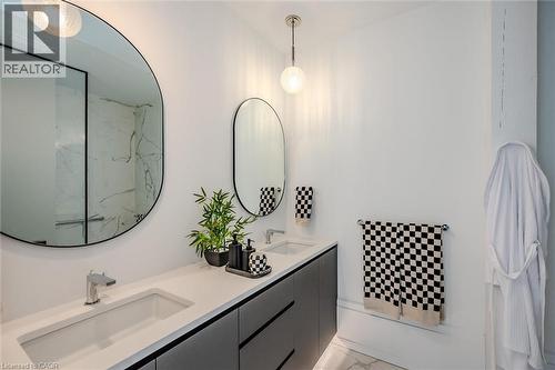 Full bathroom with double vanity and light marble finish flooring - 19 Guelph Avenue Unit# 308, Cambridge, ON - Indoor Photo Showing Bathroom