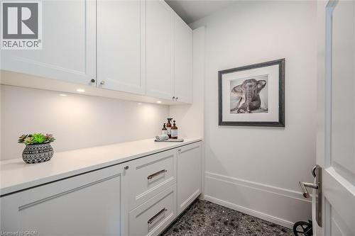 Bar area with white cabinets and baseboards - 19 Guelph Avenue Unit# 308, Cambridge, ON - Indoor Photo Showing Other Room