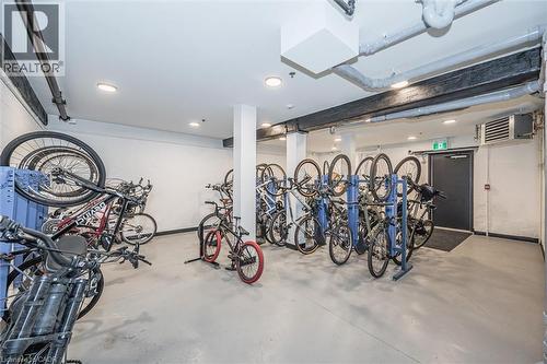 Garage with bike storage, a heating unit, and recessed lighting - 19 Guelph Avenue Unit# 308, Cambridge, ON - Indoor Photo Showing Garage