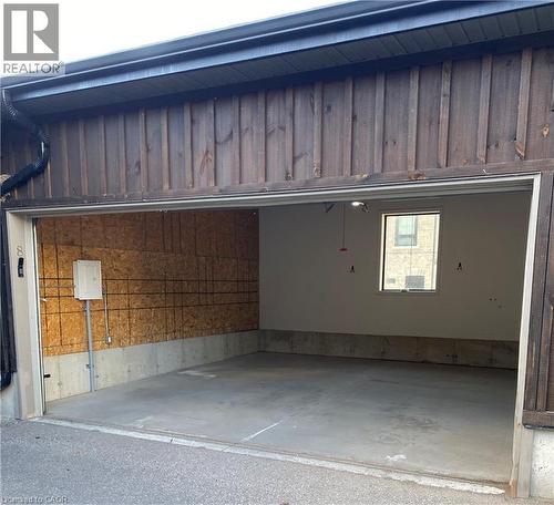View of garage - 19 Guelph Avenue Unit# 308, Cambridge, ON - Outdoor