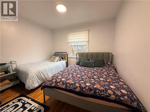Bedroom featuring wood finished floors - 501 Upper Wellington Street, Hamilton, ON - Indoor Photo Showing Bedroom