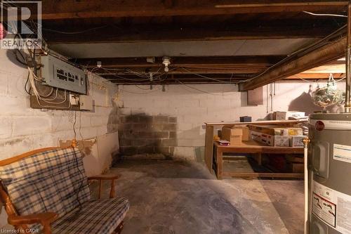 Basement featuring electric water heater - 501 Upper Wellington Street, Hamilton, ON - Indoor Photo Showing Basement
