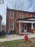 View of front facade featuring brick siding, covered porch, and a chimney - 54 Margaret Street, Hamilton, ON  - Outdoor 