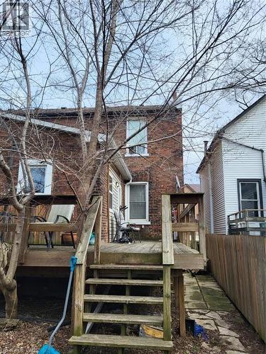 Back of property featuring a deck and brick siding - 54 Margaret Street, Hamilton, ON - Outdoor