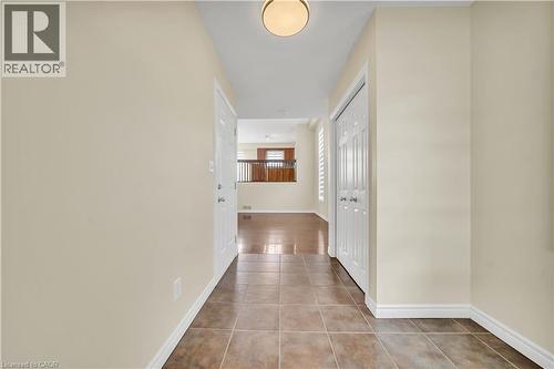 Hallway featuring baseboards and light tile patterned flooring - 51 Seabrook Drive, Kitchener, ON - Indoor Photo Showing Other Room