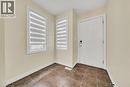 Foyer entrance featuring dark tile patterned floors and baseboards - 51 Seabrook Drive, Kitchener, ON  - Indoor Photo Showing Other Room 
