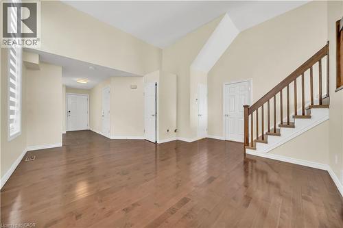 Foyer entrance featuring a high ceiling and dark wood-style flooring - 51 Seabrook Drive, Kitchener, ON - Indoor Photo Showing Other Room