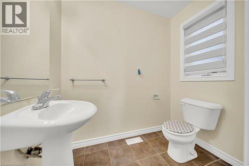 Bathroom with baseboards and tile patterned floors - 51 Seabrook Drive, Kitchener, ON - Indoor Photo Showing Bathroom