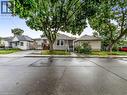 View of bungalow-style home - 74 Province Street N, Hamilton, ON  - Outdoor With Facade 