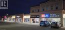 Property at twilight with view of commercial area - 645 Westmount Road E Unit# 8, Kitchener, ON 