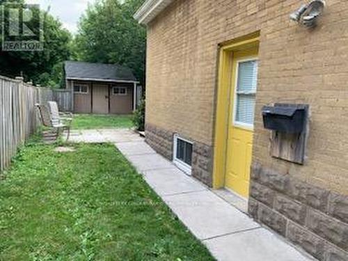 Side Door Entrance And Backyard Access - 101 Merna Avenue, Hamilton, ON - Outdoor With Exterior