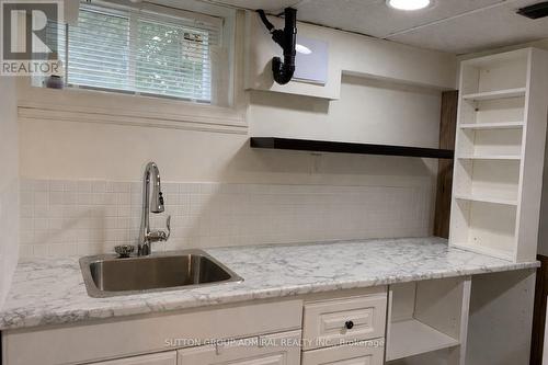 Basement Laundry Area - 101 Merna Avenue, Hamilton, ON - Indoor Photo Showing Kitchen