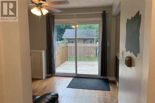 Sliding Doors To Backyard Deck - 101 Merna Avenue, Hamilton, ON - Indoor Photo Showing Other Room
