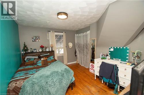 Bedroom with light wood finished floors and baseboards - 535 Mcdowell Road E, Simcoe, ON 