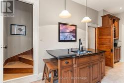 Sit At Breakfast Bar/Secondary Staircase - 