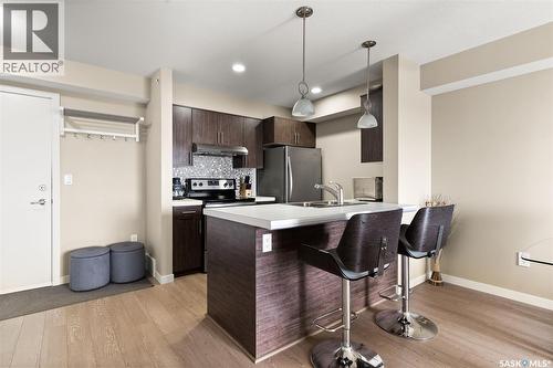 1404 5500 Mitchinson Way, Regina, SK - Indoor Photo Showing Kitchen With Double Sink With Upgraded Kitchen