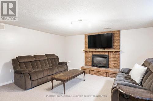 24 Laurie Crescent, Barrie, ON - Indoor Photo Showing Living Room With Fireplace