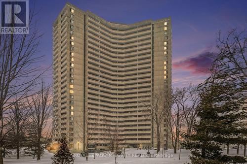 Exterior of Building Twilight - 906 - 1081 Ambleside Drive, Ottawa, ON - Outdoor With Balcony With Facade