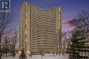 Exterior of Building Twilight - 906 - 1081 Ambleside Drive, Ottawa, ON  - Outdoor With Balcony With Facade 