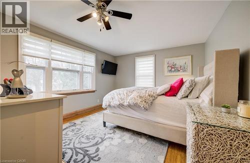 featuring 2 closets (one walk-in) and ensuite priviledge - 27 Lowrey Avenue S, Cambridge, ON - Indoor Photo Showing Bedroom
