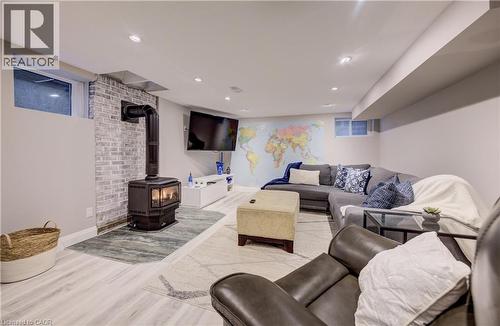 featuring a gas wood stove and recessed lighting - 27 Lowrey Avenue S, Cambridge, ON - Indoor Photo Showing Other Room With Fireplace