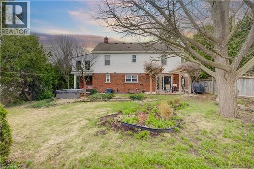 Rear view of house featuring a hot tub, and 2 patios - 27 Lowrey Avenue S, Cambridge, ON - Outdoor
