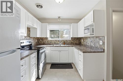 3A & 3B Bateman Crescent, Saskatoon, SK - Indoor Photo Showing Kitchen With Double Sink
