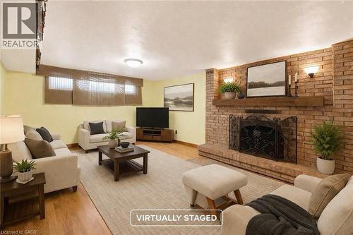 11 Pinard Street, Hamilton, ON - Indoor Photo Showing Living Room With Fireplace