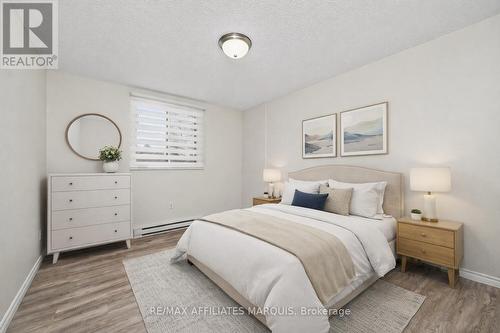 Photo is Virtually Staged - 204 - 41 Sunset Boulevard, Perth, ON - Indoor Photo Showing Bedroom
