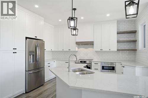 203 Sharma Lane, Saskatoon, SK - Indoor Photo Showing Kitchen With Double Sink With Upgraded Kitchen