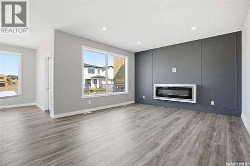203 Sharma Lane, Saskatoon, SK - Indoor Photo Showing Living Room With Fireplace
