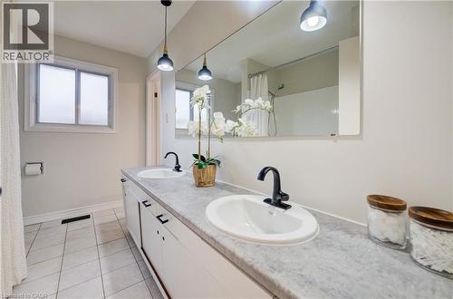 5pc bathroom with two sinks, bathtub/shower and brand new lighting. - 66 Tupper Crescent, Kitchener, ON - Indoor Photo Showing Bathroom