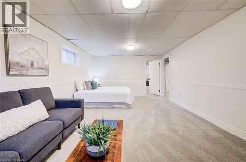 Basement 4th bedroom with lounge area and gas fireplace, a perfect spot for a teenager or in-law suite. - 66 Tupper Crescent, Kitchener, ON - Indoor