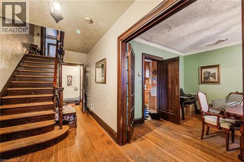 centre hall plan stairway with view to dining room - 71 Margaret Avenue, Kitchener, ON - Indoor Photo Showing Other Room