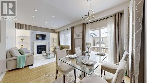 42 Foxberry Road, East Gwillimbury, ON - Indoor Photo Showing Dining Room With Fireplace