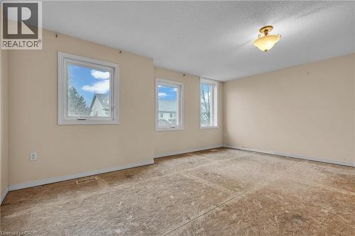 Unfurnished room featuring plenty of natural light and a textured ceiling - 26 Roehampton Crescent, Guelph, ON - Indoor Photo Showing Other Room