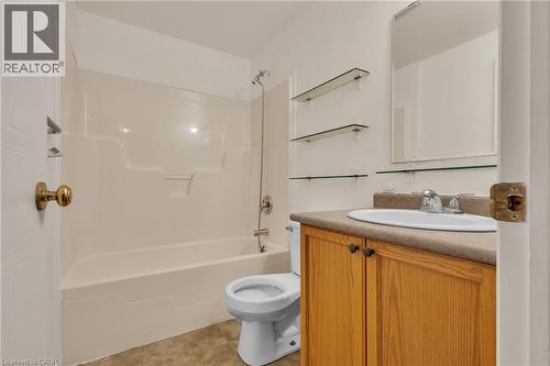 Bathroom with vanity, shower / washtub combination, and light tile patterned flooring - 26 Roehampton Crescent, Guelph, ON - Indoor Photo Showing Bathroom