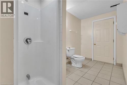 Bathroom featuring light tile patterned flooring and a shower - 26 Roehampton Crescent, Guelph, ON - Indoor Photo Showing Bathroom