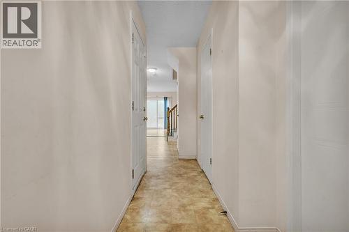 Hall with baseboards and a textured ceiling - 26 Roehampton Crescent, Guelph, ON - Indoor Photo Showing Other Room