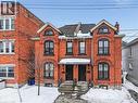View of front facade with brick siding and a chimney - 27 Ashley Street, Hamilton, ON  - Outdoor 