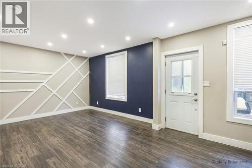 Entrance foyer featuring dark wood-style flooring and recessed lighting - 27 Ashley Street, Hamilton, ON - Indoor Photo Showing Other Room