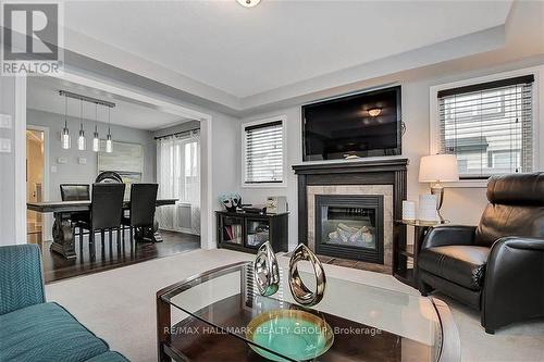 81 Switch Grass Crescent, Ottawa, ON - Indoor Photo Showing Living Room With Fireplace