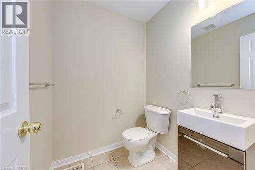 Bathroom featuring light tile patterned floors and vanity - 3037 Abernathy Way, Oakville, ON - Indoor Photo Showing Bathroom