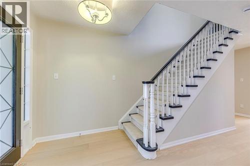 Foyer with light wood finished floors and stairs - 3037 Abernathy Way, Oakville, ON - Indoor Photo Showing Other Room